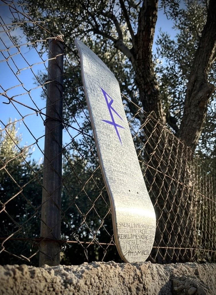 RebelTimes Skate Deck — Silver Rain of Scripts by Thom